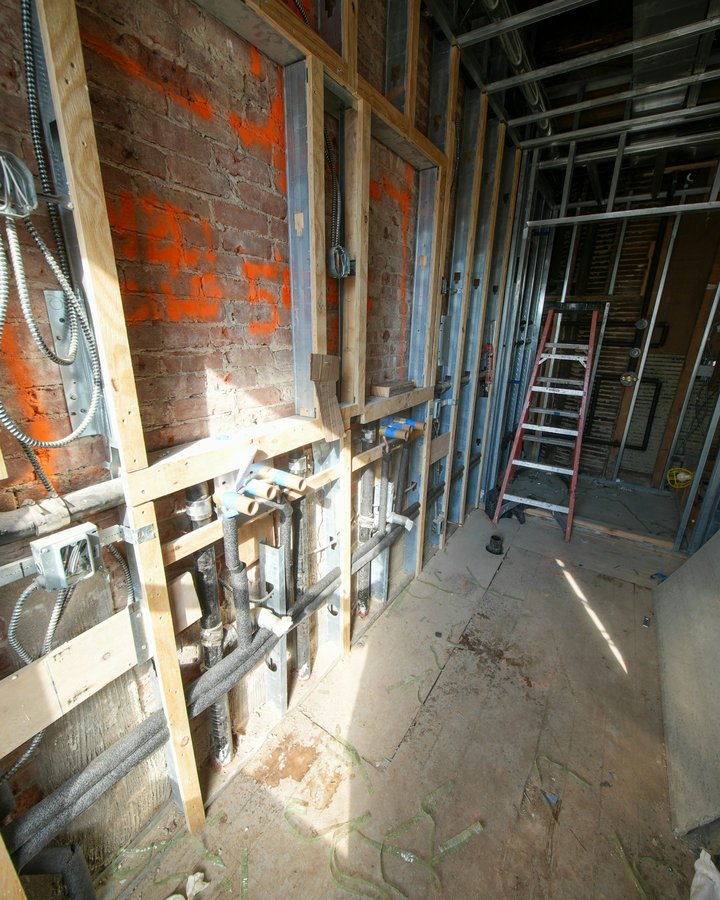 Renovation in progress: metal studs, new pipes and electrical boxes