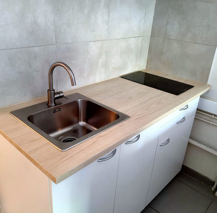 Renovated kitchenette with oak worktop, sink and hob