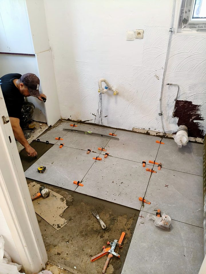 KALIX team laying floor tiles