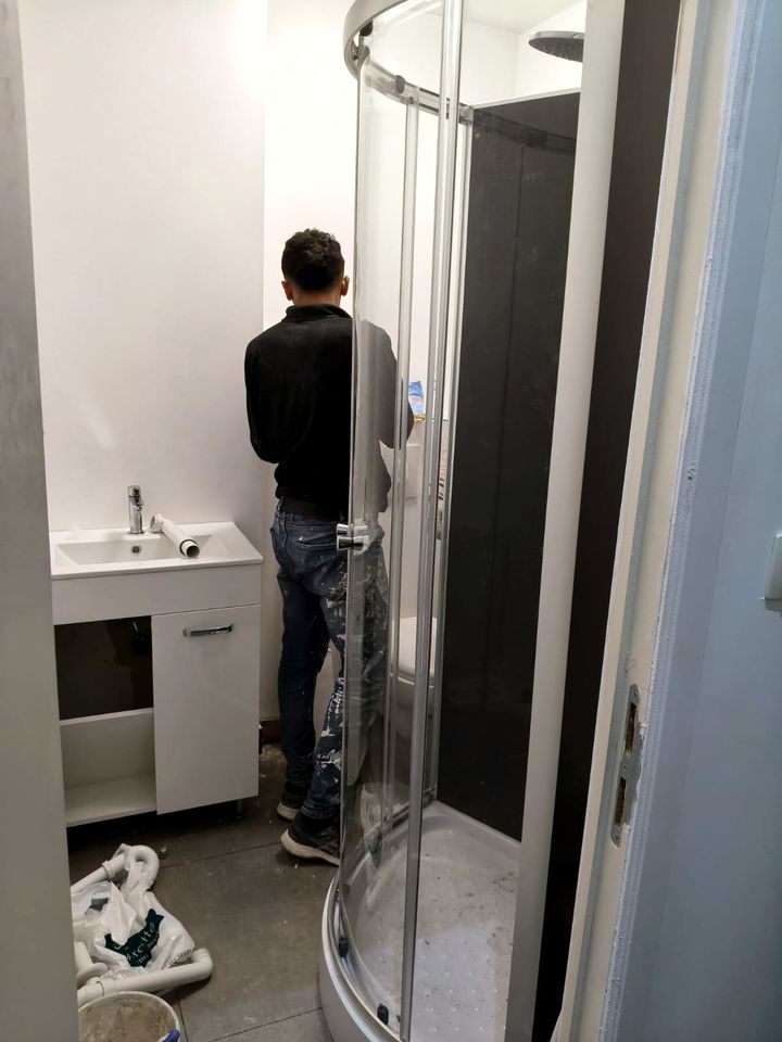KALIX team installing a shower and vanity unit