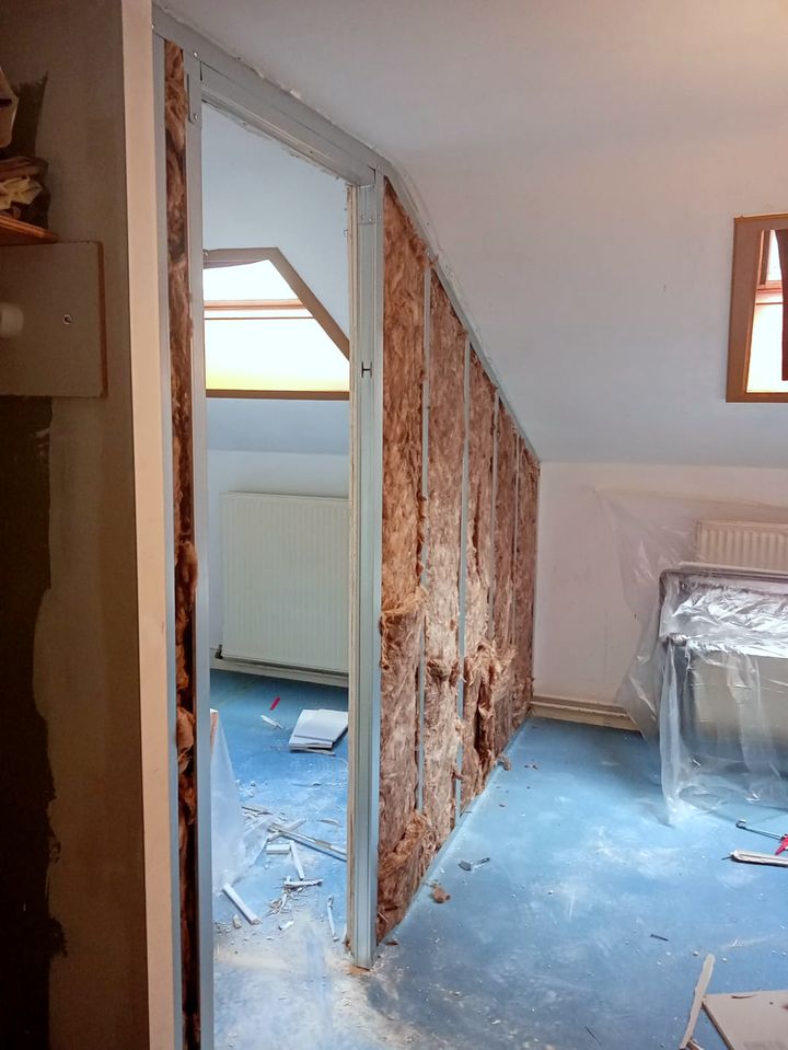 Old wall stripped back to the insulation